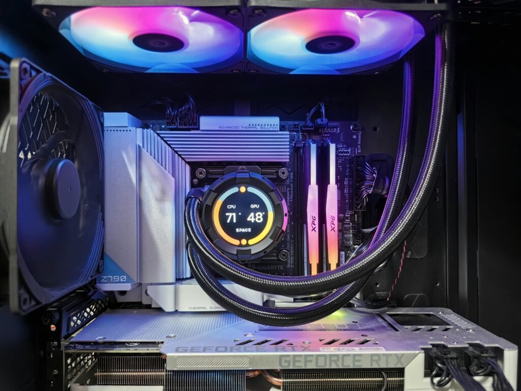 Close-up of a high-performance gaming PC showcasing RGB cooling fans, GPU, and hardware components.