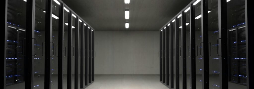 Spacious data center with aligned server racks and LED indicators.